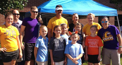 Tech student-athletes help at Capshaw Elementary School Cougar Run