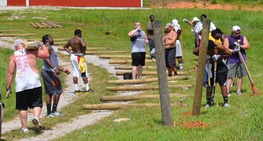 From fenceposts to painting, Tech football players help at Mustard Seed Ranch