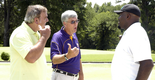 Former NFL Pro Bowler Jim Youngblood (left) and Golden Eagle head coach Watson Brown (center) discuss rules of golf (or something?) with eight-year NFL veteran Frank Omiyale. Photo by Mike Lehman