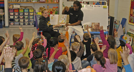 Women's Basketball reads to Kindergarten classes at Jere Whitson school